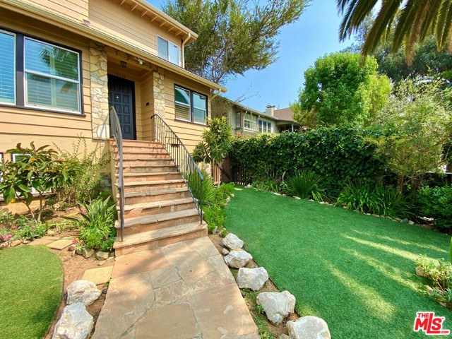 15319 Earlham Street Pacific Palisades, California Rich in Hollywood's history built in 1956. This Gorgeous mid century property is a rare beauty located in the Pacific Palisades. As you enter the foyer, you are welcomed with the intimate wood burning fireplace, elegant handcrafted wood beam ceilings, hardwood flooring and authentic tiles. The generous entertaining spaces include the chefs kitchen with a breakfast dining area, formal dining room, living room, library/den, 2 ensuite bedrooms seamlessly opens to the backyard which perfectly captures the afternoon sun, lush gardens and variations of exotic fruit trees. As you ascend up the stairs to the second story, take in the outdoor views from the over-sized picture window leading to the master suite with a soaking jet tub, sauna, 4 additional en suite bedrooms. Separate caretaker's quarters and pool house, solar panel system, salt water pool and jacuzzi. Entertain or relax in your media basement, which includes a guest room and access to your 2 - car garage.