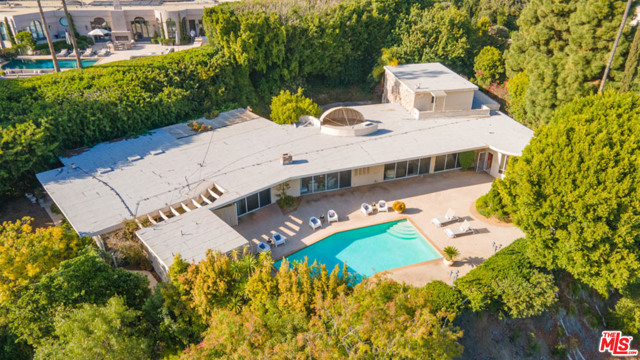 1111 Shadow Hill Way Beverly Hills, California Available for the first time in over 55 years! One of the most significant properties in the neighborhood! 1111 Shadow Hill is the former estate of Mel Torme & Zeppo Marx. This exquisite single level home sits on a knoll & boasts a HUGE lot just a hair shy of 27Ksqft, with about 14Ksqft flat. The lot has a magnificent motor court & mature trees that provide a rarified secure/private lifestyle. As you step inside, tall ceilings & gorgeous terrazzo floors are bathed in natural light. Stroll into the backyard and look out at one of the most desired views in the city of Beverly Hills. Completing the spectacular grounds are a lovely pool w/ detached pool house. All of this in the most superb location perched just above the Beverly Hills Hotel, a skip away from Rodeo Drive shopping & a walk away from Coldwater Canyon Park. Its easy to imagine lavish parties here with all of Hollywoods elite.