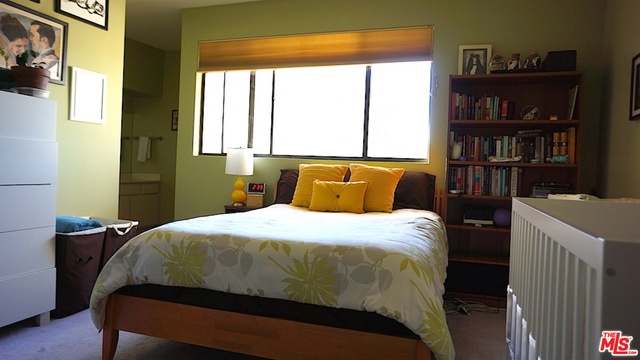 Bright Master Bedroom with tree top views