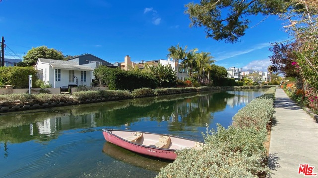 3003 Grand Canal Venice, California One of a kind. The largest single family zoned canal lot. Let your imagination run wild to create something unique and truly amazing. The current bungalow can be rented during the permitting process or used by new owner as a pied-a-terre to experience the Venice lifestyle on the historic Venice Canals just walking distance from some of the hottest places in town. Lot size and zoning provide a wide array of development opportunities with none of the restrictions of multi family or historically designated properties. Enjoy ocean breezes and walks on the canals. Two blocks to the sand and an array of bars and fantastic restaurants.