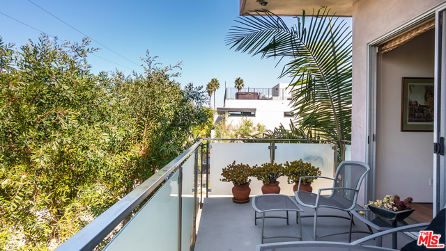 2405 Wilson Avenue Venice, California Ideally located on a quiet olive tree lined street, a stone's throw to the canals and beach. This stunning contemporary home offers the best in beach lifestyle. With eco friendly heated polished concrete floors and soaring open beam ceilings off outstanding entertaining and living spaces. Grand room sizes with 12' walls of glass opening to serene private courtyard with wrap around garden space and mature landscaping. Cooks kitchen with stone counters and stainless appliances. Dining room with giant glass wall opens to dramatic water feature. Upstairs with gracious outdoor patios offering beautiful sunrise and sunset views. Tremendous master suite with sitting area, walk in closet, fireplace, and views. Oversized finished garage with ample storage.
