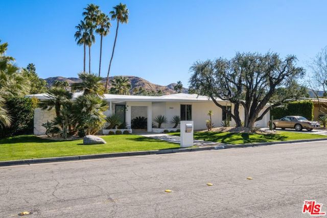 2660 S Calle Palo Fierro Palm Springs, California Featured at 2020 Modernism Week, this immaculate Indian Canyons home has been meticulously remodeled and is being offered with selected furnishings! With panoramic mountain views in all directions, the large yard features a Pebble Tec pool/spa, sitting area w/firepit and amazing LED lit landscaping. The open floor plan offers walls of glass to the pool and views & the living room area is highlighted by an elegant walnut faced fireplace. The open kitchen features custom cabinets, Caesar stone counters, SS Miele/Viking appliances & a breakfast bar. The master, w/sliding doors to the yard, boasts a luxe bath with 2 sinks, soaking tub, separate shower and bidet/toilet. The largest of the 3 guest bedrooms, currently used as a family room, features an 85in TV & wet bar. With remodeled baths, designer LED lighting, newer windows & doors, Nest & solar, this home will satisfy the most discerning Buyer. Other features include: Keyless entry; Solid core doors: Garage w/built-ins & 2 EV outlets.