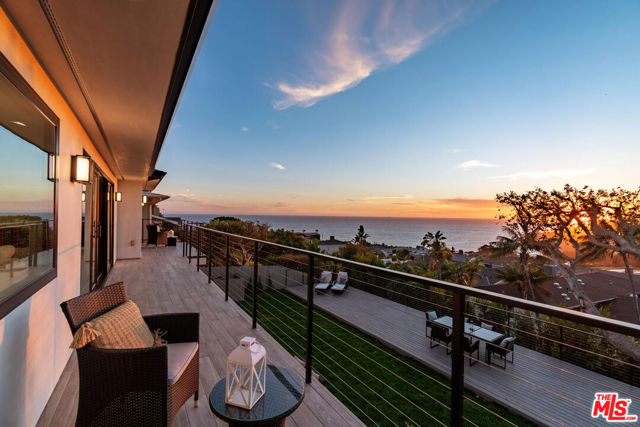 243 Notteargenta Road Pacific Palisades, California Magnificent renovation in the most desirable Pacific Palisades Castellammare Mesa location!! Stunning finishes to highlight a spectacular view of the ocean, coastline, hillside, Sunset Mesa and the Santa Monica Mountains. Impressive front curb appeal with exterior brick, plaster and board and batten finishes, and designer double door entry that opens to a breath taking enormous living space with soaring high architectural ceilings over entire kitchen, dining, and living area, all looking out to a full length balcony, custom railing, VIEW and back yard. Chef's kitchen with complete upscale appliance package, massive cook's island, and Butler's Pantry all with extensive use of beautiful Quartz, and Marble! Dream master suite with view, spacious custom-built walk-in closet, 2nd closet and built-in cabinetry, gorgeous bath with, standing tub, oversized shower, and exquisite marble counters and tiles!! Three additional bedroom suites with luxurious baths as well, with matching lighting, custom mirrors and top of the line faucets. Custom designer railing on staircase leading down to an open entertainment room looking out to the uniquely landscaped backyard with huge patio, barbeque island, and massive deck!! From the front to the back and from the top to the bottom, this is a picture perfect package that stands out from all the rest!!