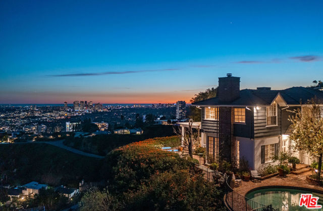 Located at the end of a cul-de-sac and down a gated, private driveway, this rare promontory property is situated on nearly an acre of land in prime Sunset Plaza, all while featuring unobstructed panoramic views from downtown to the ocean. The approach to the home reveals an expansive motor court and a 3 bedroom/4 bathroom main residence, as well as a 1 bedroom/1 bath guest house. According to Underbuilt, the land has the potential to build a 11,368 sq ft residence -- Buyer to verify this information. This is an exciting opportunity to remodel, expand or build the next modern masterpiece in this highly sought-after location with the Los Angeles basin as the backdrop to your dream home. This property is a rare find. Do not miss.