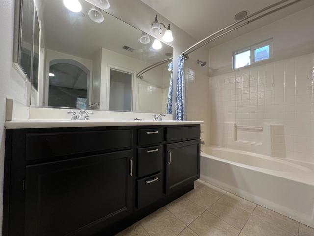 BATHROOM WITH BATHTUB IN MASTER SUITE BEDROOM 2.