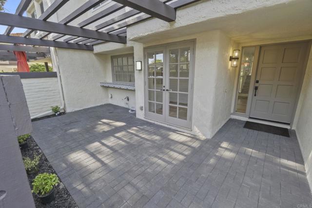 French Doors lead to inviting front Patio! Add Cozy Furniture, F & F, Charcuterie, Wine!  ENJOY!