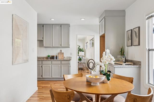 Dining space featuring light wood-type flooring and recessed lighting
