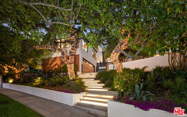 Located on a beautiful tree lined street in the prestigious neighborhood of Little Holmby sits this gated, one-of-a-kind Transitional home. Travel up the elongated driveway to private gates that open to the large motor court set just before the front door. Newly remodeled, the home showcases ~7,400 square feet with 8 bedrooms and 10 bathrooms. Revel in the voluminous entry with soaring ceilings, a grand staircase, wide plank European Oak floors, a skylight, and walls of glass that emphasize the natural light and indoor/outdoor flow throughout. Timelessly remodeled, the gourmet chef's kitchen is outfitted with bespoke white cabinetry, top-of-the-line stainless steel appliances, and an imposing island with waterfall quartz countertops. The expansive primary suite offers a large seating room, deck, fireplace, and his/her spa-like bathrooms that include generous closets. Perfect for both entertaining and relaxation, the expansive backyard hosts a newly plastered pool, al fresco dining, an abundance of lounge seating and direct access to the stairs that lead to a rooftop deck. Additional highlights include: guest quarters, new HVAC, new Euroline steel doors and windows, and an upgraded security and camera system.