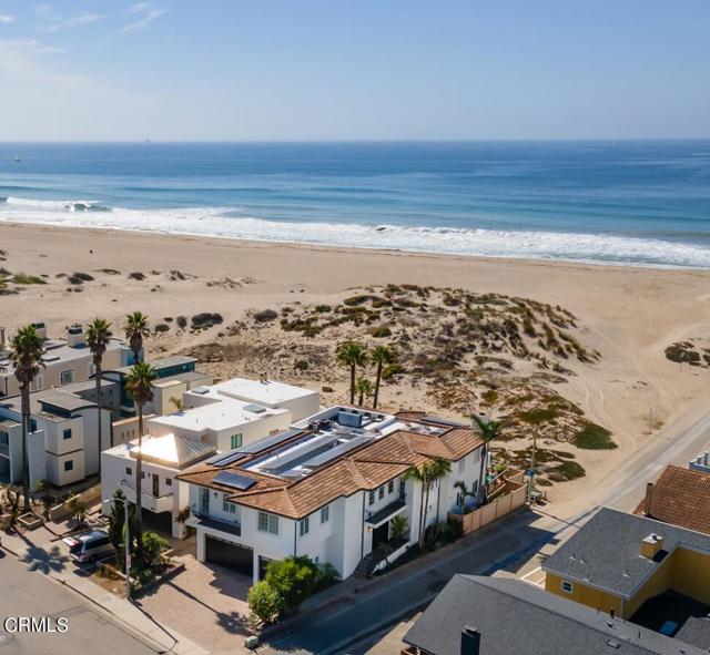 Amazing OCEAN VIEWS from all Levels of this unbelievable home, highlighed by one of very few homes with about 500 Sq-Ft ROOF-TOP Decks w/ large Jacuzzi that offers Spectacular Ocean & 360-Degre Panoramic Ocean Views. Enjoy the life of California Dreamin' in this Stunning Ocean Front home in Mandalay Shores, where the beach is your backyard.  This Custom Masterpiece was built in 2006 by renowned Ventura County Master Builder Robert Sandefer who is best known for his Quality of Craftmanship, attention to detail & flowing floorplan that seamlessly blend with the Captivating Ocean Views.  This home is fantastic for larger families & for entertaining, combined w/ timeless Exterior & Interior perfection. 62-FT OCEAN FRONTAGE, quite possibly the largest in the Shores & situated on a Lot Size of 6,486 Sq Feet.  Offering one of the Largest Ocean Front homes, approximately 50-Feet Wide..  This unbelievable Property includes a Spacious ELEVATOR5-Decks, Patios & Balconies w/ approximately 2,000 Sq Feet.  As you Enter, you will Experience a Grand Entryway w/ Soaring Vaulted Ceilings & Dramatic Stairway.  The Huge Primary Suite including a spectacular Massive Closet Area w/ Spaciuous built-in island & fantastic Sauna, as well as 2-additional Bedrooms & 2-Baths.  The 2nd Level includes an Open Floor Plan including an Amazing Living Room with Beautiful Ocean Views, large Wet Bar, & Fireplace.  that open to the Living Room.  The Beautiful expansive Dining Room that opens to the Living Room includes access to a Romantic Balcony.  Amazing Kitchen with huge Island & Custom Cabinetry with amazing storage space & Formal Pantry. The 2nd Floor is punctuated with a Large Family Room / Den as well as 2- Expansive En-Suites with Large Closets & exclusive Balcony. Also, the Home includes a 3-Level Elevator, a Climate Controlled Wine Room, a 600+ Square Foot 3-Car Garage., Roof Top Solar Panels, as well as a Retractable Deck Awning.  All in close proximity to the Phenomenal 4-Star Resort Zachari Dunes & the beautiful & pristine Ololkou Beach Park which offers Yoga on the Sand & on the Grass 7-Days a week as well as amazing Beach Front Paths as well as all type of other activities in addition to the Channel Islands Harbor & Fantastic Restaurants. Welcome. Home to the most Amazing Property for Living in Perfect Harmony w/ the Ocean, enjoy this Amazing Sanctuary for you, your Family as well as Entertaining Guests.SELLER CARRY BACK Financing possible w/ competitive Interest Rates.