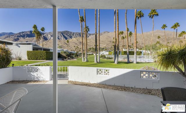 From the great room and the patio, views of the greenbelt are in foreground with the mountain ridge in the distance.