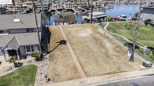 Aerial view of residential area featuring a large body of water