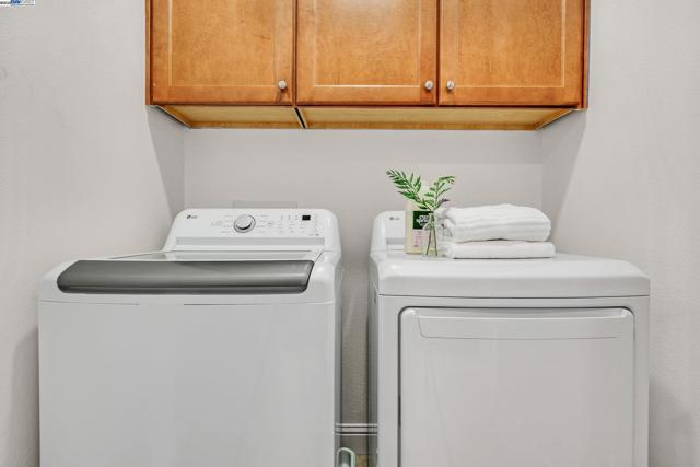 Laundry room located near three bedrooms