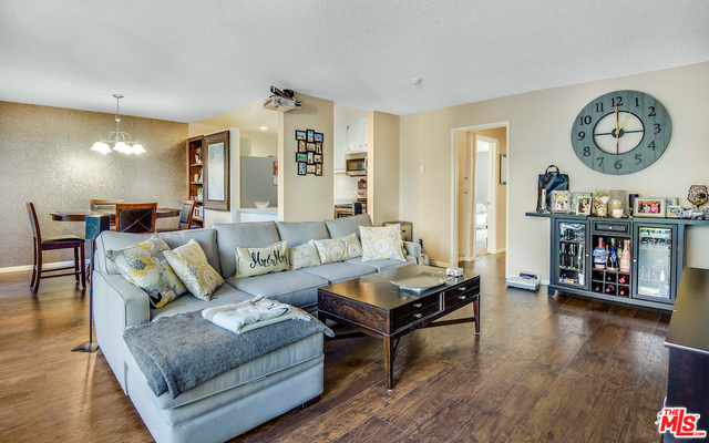 Dining area open to living room which opens to kitchen