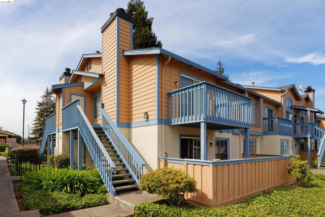 Multi-level exterior with horizontal siding and stucco accents