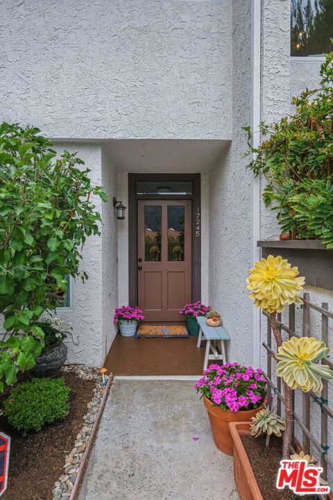 17245 Palisades Circle Pacific Palisades, California Absolutely Charming 3 level Townhome. Beautiful private master suite on 3rd level with balcony and stunning mountain views. Enter from garage to mid level living room and dining area, with rich hardwood floors and kitchen with breakfast area looking out at the mountains beyond. Downstairs,on the ground level is a second bedroom and bath ,plus a spacious family room which could become a third bedroom. This leads to a large private patio with glorious mountain views. The home shows pride of ownership in every detail. Shown by appointment. .All visitors to wear face marks and sign car form PEAD-V before showing.