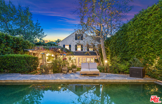 220 S Carmelina Avenue Los Angeles, California Charming New England Traditional home set on a picturesque tree-lined street in Brentwood. The expansive backyard, manicured garden, and pool make this home a perfect retreat. The interior features great architecture with period detailing with a beautiful living room with a bay window, 4 fireplaces, and a formal dining room with French doors. The welcoming study makes working and studying from home idyllic. Gather in the large great room and enjoy meals in the cooks kitchen, breakfast area & generous sitting area. This rare opportunity to live in this charming house on the most picturesque stretch of South Carmelina.