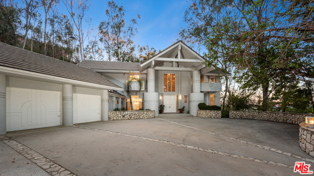 12063 Summit Circle Beverly Hills, California Rare opportunity in The Summit! Large, light filled home with lots of volume. Four upstairs bedrooms, each with their own bathroom, one bedroom and bathroom downstairs. Private and serene backyard with pool and spa. Remodel, and take this home to the next level in the guard gated Summit.