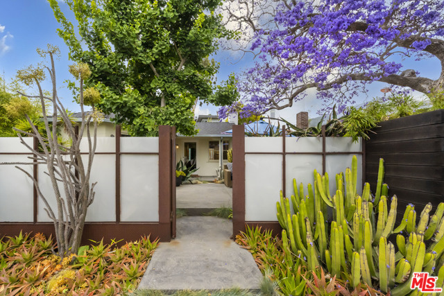 819 Milwood Avenue Venice, California One of a kind Venice compound on a large double lot over 8,144 sq ft! This property has so much to offer. Amazing location within walking distance to Abbot Kinney Boulevard and to the beach. ATTENTION to end-users, developers, and investors.The front entrance of this beautifully remodeled bungalow is gated with both a car entry and a pedestrian entrance. The front patio allows for a tranquil space where you can relax amongst the mature landscaping. The main home is a gorgeous remodeled 2 bedroom 1 bath space with over 1,600 sq ft of living space. There are several access points from the main home to the additional structure. The back of the property is filled with endless opportunity to fit the needs of a variety of users. You will be able to transform the additional 3,600 sq ft into anything from an art studio, work-from-home office space, music/dance studio. It's a great space for entertaining as well. This additional space was designed by award-winning architect Steven Ehrlich. One of the eye catching architectural details includes a steel bridge that connects the apartment to living area/apartment. Tons of open space with stunning 30 ft high ceilings and plenty of natural lighting. You'll also enjoy a spectacular view from the rooftop deck that looks out towards the ocean. This fantastic property was once owned by Lenny Kravitz and Lisa Bonnett.