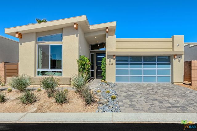 4149 Indigo Street Palm Springs, California This former model home has every bell and whistle and then some including home automation a new air system electric blinds and much more. Enjoy the luxuries of newer construction such as the chef's kitchen featuring stainless steel appliances with large center island. The living room opens out in to a private backyard complete with- spool (pool and spa) and water feature, outdoor TV lounge area with fireplace, BBQ grill with bar, and fire pit with lounge area. Perfect for entertaining in the highly sought-after desert climate. Owned solar power provides the property with substantially lower power bills. Located in central Palm Springs, you can enjoy the views of the San Jacinto Mountains, local golf courses as well as close proximity to the Downtown shopping and entertainment area and Palm Springs International airport. Escena community also boasts a Dog park, public Golf Club and the Escena Lounge and Grill, providing a convenient location to dine and host.