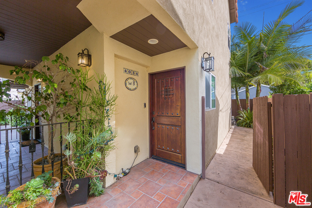 4034 Madison Avenue Unit B Culver City, California Quiet, spacious, two bedroom rear unit of a triplex walking distance to Culver City's vibrant pedestrian friendly arts & dining downtown. Spacious tiled kitchen & dining area entered from huge 2 car garage with storage space & electric car charger are on the first floor with a half bath, pantry, lots of cabinets, and additional storage under the stairway. Behind the kitchen is a private high fenced back yard with many shrubs and a fountain. The kitchen has quality appliances including washer and drier, GE Profile range/ stove and vent hood. Upstairs is a large hardwood floor living area and the hallway to the two bedrooms, one a master suite, and the second large bathroom. An attic with pull down stair and finished floor affords substantial lightweight storage. Good natural light, recessed lighting, built in data and cable connections, high ceilings throughout. Lynwood Howe Elementary School is close walking distance. This home offers all the advantages of central Culver City living