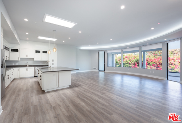 1350 ROXBURY Drive PH305 Los Angeles, California This breathtaking 4 bedroom, 2.5 bath front unit penthouse is appointed with exquisite details and finishes. This home has hardwood floors in living quarters, large view balcony, cozy gas fireplace, oversize modern kitchen with Caesar stone counters, custom cabinetry, stainless steel appliances including 2 dishwashers, 2 kitchen sinks, 2 mini refrigerators, large wine cooler. The master suite has a large spacious closets and stone bath with tub and shower separate and double sink. For a bonus-- the unit has a large secluded roof sundeck and 3 car parking.