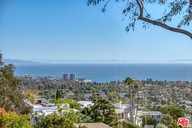 1425 Chautauqua Boulevard Pacific Palisades, California This large gated estate lot is located on a private street, and is perched on a knoll near the top of Chautauqua Blvd in Pacific Palisades. Panoramic views of the Pacific Ocean, Downtown Los Angeles, Century City, Westwood, Santa Monica, Pacific Palisades Village and the Santa Monica Mountains. Incredible potential to redevelop the site and build a new home. Great for someone seeking both privacy and views.