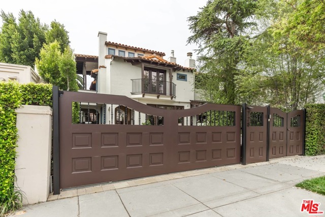 728 12Th Street Santa Monica, California North of Montana, this 1924 Spanish revival villa has had every detail attended to. Slightly under 5,000 square ft, the gated villa defines meticulous elegance within a casual confident lifestyle. Entrance French doors reveal the sunken living room where you will find first of seven fireplaces. Next to living room is downstairs guest suite. Continuing on main level is dining room w/ third fireplace. Family room w/ custom cabinetry & 85-inch surround sound media wall. Chef's kitchen has 48-inch Subzero fridge, Double Wolf range, custom pantry, oversized island, marble counters and commercial hood. Architectural staircase winds up to master suite and two equally impressive additional guest suites. Master boasts Lutron lighting and shades,surveillance, control panels, skylights, 20-foot ceilings & covered patio overlooking yard. Guesthouse sits on rear of property with custom iron work barn doors & indoor parking for 4 vehicles + half bath. Upstairs is home office like no other. Twin limestone fireplaces, original restored wide plank flooring, gallery lighting, full wet bar w/ controlled wine storage and twin flat panels w/ sound system & covered deck. Moments from bars & restaurants of Montana & w/ 8 off street parking. Highest accolades from the most discriminating of buyers.