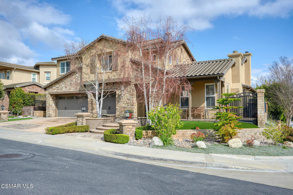 1528 Honey Creek Court Newbury Park, California Stunning FURNISHED 4000+ square-foot residence, tucked away in the exclusive gated community of Rancho Conejo. Experience the freshly painted exterior, extensive exterior hardscape, custom stone-work, and a meticulously designed drought tolerant landscape. Step inside the dramatic rustic door to discover luxurious interior featuring custom paint, Padavo designed furniture, and rich ceramic wood-like flooring. The spacious floor plan seamlessly blends warmth and elegance, creating a perfect harmony of luxury and comfort. The huge living room features abundant natural light, perfect for relaxing and enjoying the views through the large windows and rich shutters. The enchanting courtyard with stone fireplace is the ideal setting to sip your favorite beverage and escape to tranquility. The chef's dream kitchen offers top-of-the-line appliances, a gigantic center island, and wine pantry that leads to the spacious dining room, illuminated by one of three hand-made iron chandeliers. Wrap up your day in front of one of two fireplaces that transport you to the finest Tuscan estate. Entertain under one of two newly constructed oversized pergolas, taking in the privacy and serenity that surrounds you. Your guests will retire to their own private downstairs ensuite, as you head up the hand-scraped solid plank stairs to your bright and airy primary retreat with stunning views., featuring dual walk in closets, and a magnificent bath that rivals any five-star resort. Along with three additional spacious bedrooms, upstairs highlights include a custom designed work space, a laundry room with abundant storage The quality continues into the garage featuring dual layer epoxy floors, trackless garage door system, custom cabinets and overhead storage, This rarely available floor plan offers an exceptional blend of luxury and warmth. You'll feel like you're in Tuscany at every corner of this home, making it the perfect retreat for those seeking elegance, tranquility, comfort, and beauty.