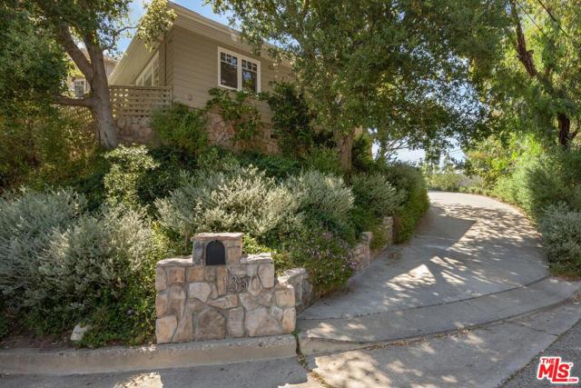 1350 Monument Street Pacific Palisades, California This beautiful, warm and welcoming home has it all.....serenity, privacy, lots of natural light, mountain views, ocean views, open space, luxury, convenience, perfect for entertaining, high ceilings, crown moldings, closets galore, incredible details, built-ins, walnut hardwood floors, cherrywood kitchen counters, natural stone in and out, recessed lights, wainscoting, pantry and much more. In this five bedroom home, the master suite is upstairs, three bedroom suites are downstairs and the housekeeper/or office is tucked away on the first floor. The spacious living room is welcoming and has a dramatic view of the Santa Monica mountains and hiking trails, a fireplace and bookcases built in...."feels away from the city". The separate, formal dining room has views of the mountains and the ocean and outdoor access. The chef's kitchen has been used by chefs, is a fabulous gathering space, and has all the best appliances, a center island and views along with a true breakfast room. The large, adjacent family room, with a fireplace and outdoor access, flows from the kitchen and also has natural stone floors, built in bookcases and a warm feeling. Each of the spacious bedrooms has a unique view. The master has an ocean view, a huge master bath and a lovely, peaceful sitting room. This home was built by a respected local builder using only first class materials and upscale finishes throughout. This meticulously maintained home, with its amazing details, its special ambiance and beautiful outdoors is exceptional. This is a home to be loved and treasured. At the top of Monument Street. Convenient to Palisades Center, businesses and restaurants. One of the best locations in the Palisades.