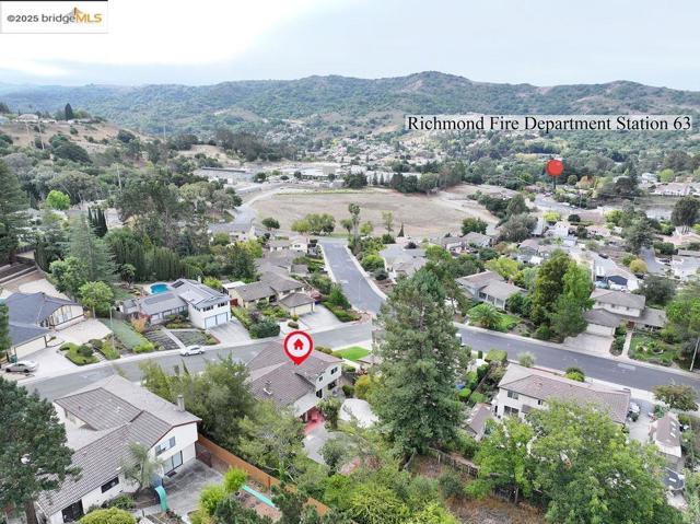 Aerial perspective of suburban area featuring mountains