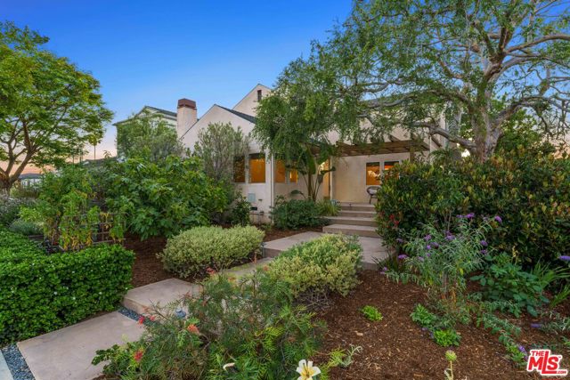 1351 Hill Street Santa Monica, California **Offers due 7/1 @1pm** Sparkling, warm & spacious on a superb and beautifully landscaped, corner lot in prime Sunset Park. A rare offering of this rebuilt (2005) architectural residence, executed w/artful finesse and attention to detail in form and function. Soaring open spaces, center hall plan, expansive walls for art, wood floors, all flooded w/natural light. Features include a spectacular living room w/high vaulted ceilings & fireplace, banquet-size formal dining room w/vaulted ceilings & an open concept kitchen-family room combo at rear of the home with a large cooks kitchen with multiple eating areas and adjacent family room with fireplace and large sliding doors that open to a covered outdoor terrace and a picture-perfect yard with pool/spa, turf, outdoor lighting and patios for entertaining. A total of 4 bds including a primary suite w/garden-view balcony, luxe bath w/oversized steam shower & separate tub, and walk-in closet, two guest bedrooms w/shared bath upstairs, full laundry rm, plus a guest rm/office & bath on the main level. Not to be missed: a detached guest studio w/bath & private gated access, plus a rebuilt garage w/extra attic storage & a locavore's dream "at home" farm-yard w/20+ varieties of bearing fruits/vegetables, chicken coop & outdoor shower. Main house: 4bd, 3ba, approx 2,659 sf; guest studio: 1bd, 1ba, approx 320 sf
