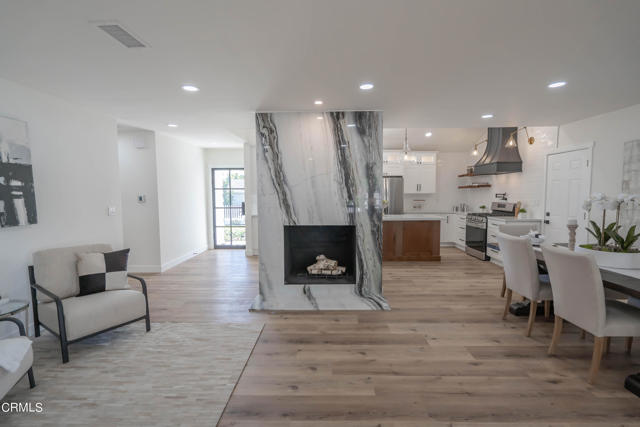 Marble Slab Fireplace centers the space