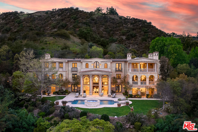 11025 Anzio Road Los Angeles, California Previously Listed at $23,800,000. This is an incredible Value for Bel Air. Newly reimagined for 2021 with hundreds of thousands in upgrades, this Tuscan-inspired Bel Air beauty is upgraded with a warm, contemporary aesthetic that elevates its existing elegance to a new level. Villa di Ricci, an ultra-exclusive estate nestled in the hills off a semi-private road behind double gates, ringed by dramatic canyon & city views, minutes away from Sunset. An entertainers paradise, it has an indoor-outdoor resort-style design with multiple terraces, plus 1.5 acres of freshly landscaped grounds that center around a pool with a spa and arcing fountains. Host in the formal living room open to a covered loggia or your choice of a formal dining and wine room; a gourmet kitchen with a breakfast room & service kitchen or linger over drinks in a salon with a full bar. Treat yourself to an in-house spa-style dry & steam sauna, gym, massage room, more. This smart home is also equipped with an elevator, stunning home theater and parking for 7 car collector's dream.