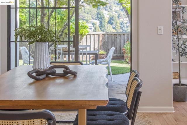 Dining space with baseboards and wood finished floors