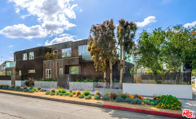 2800 Dell Avenue Venice, California Stylish & warm architectural! Stunning new construction on a large corner lot, close to the beach & famed Venice canals! This light-filled, high-style home artfully blends beautiful limestone walls with rich walnut cabinetry. The polished, custom concrete floors are surrounded by indoor gardens & walls of glass that open for seamless indoor/outdoor living & entertaining. One-of-a-kind lighting design, beamed ceilings & copper hardware finishes create a Statement Home of the highest caliber. An open concept floorplan allows 3,630+/- sqft of living space with 4 en suite bedrooms upstairs including a sumptuous master suite with vaulted ceilings, fireplace, large private deck overlooking the grassy yard & a gorgeous spa-retreat wet room bath. Mature landscaping & a beautiful custom-designed geometric black steel wall surrounds the home lending style, shade, privacy & security. Masterful vision & craftsmanship resulting in a luxury SoCal home & work of art!