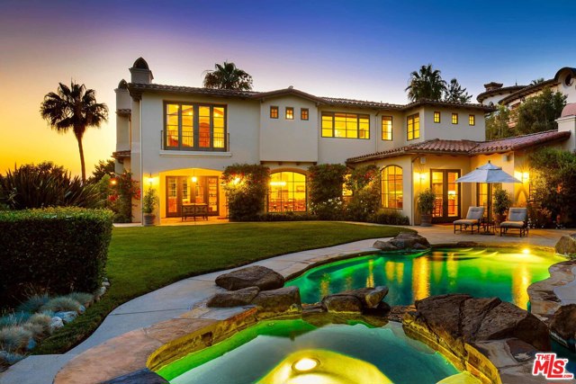 1779 Chastain Pacific Palisades, California Designed by renowned architect Doug Burdge and built in 2005, this custom-built five-bedroom, six-bathroom masterpiece is one of The Highlands' most prestigious offerings. Ideally sited on the Chastain rim to maximize the explosive ocean and mountain views. The exquisite design utilizes the finest finishes and details featuring Pella windows, French doors, and beautiful wood and stone floors. A fabulous chef's kitchen opens to the spacious family room with soaring beamed ceilings, creating the perfect atmosphere for intimate moments or grand entertaining. The private master suite enjoys exceptional views that tower over the canyon towards the ocean. Dual spa-like bathrooms and a wood-burning fireplace complete this tranquil retreat. The resort-like backyard is beautifully landscaped and features a custom pool and spa, built-in Viking outdoor kitchen, and cozy loggia with firepit, all on a spacious, nearly half-acre lot.