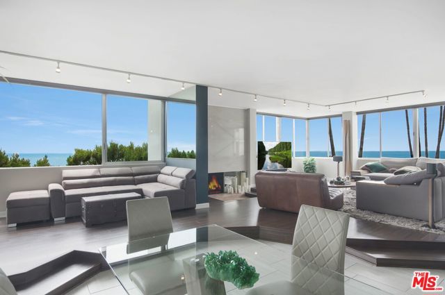 17366 W Sunset Boulevard 205B Pacific Palisades, California PRICED FOR IMMEDIATE SALE. UNOBSTRUCTED OCEAN VIEW UNIT. Spectacular ocean VIEWS from the Santa Monica Pier to Malibu from every inch of this corner unit. Sophisticated resort-like living directly across from the ocean, views of Sunset Surf Break from the living room, kitchen guest room and master bedroom; complete with all new top down/bottom up motorized blackout shades throughout. A Guarded gate entry welcomes you to this wonderful sprawling complex that offers 24 hr security and privacy with great amenities such as the gym, tennis / basketball courts, newly refinished swimming pool and private hiking trails that allow you to capture the expansive ocean views as well. Located near the beach with easy access to Pacific Coast Hwy. Perfect location to enjoy the beach life while commuting to all parts of the CIty. There is 1 covered garage parking spot along with 2 storage spaces and plenty of easy visitor parking. Monthly HOA dues include water, electricity, gas, cable and internet. Tenant occupied. No Showings to this point. Email LA1 to be added to the list for the first showing.