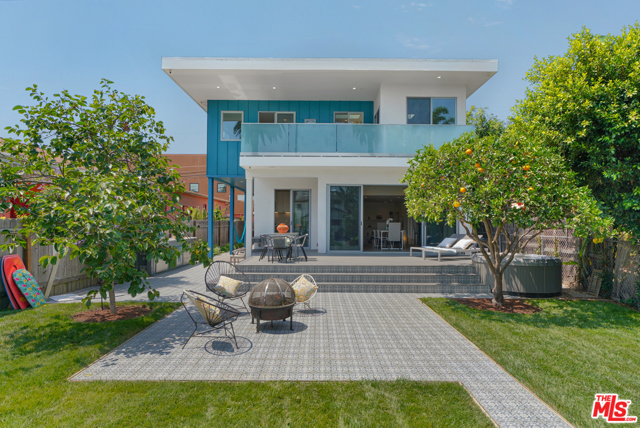 611 Flower Avenue Venice, California The perfect home for those seeking the beachy lifestyle without sacrificing the best of city living. Recently custom rebuilt for the owner from the ground up creating a garden paradise that captures the fresh ocean breeze and California sunlight. Indoor/Outdoor living blends excitement and functionality just 8 blocks from the beach and 1/2 a block from trendy Rose Ave. Come home from lunch at Caf Gratitude to this thoughtful and meticulously executed 6 bed/4.5 bath home flooded with natural light creating the ideal modern beach home. With 2 bedrooms on the lower level and 4 bedrooms upstairs, options for an office and/or den/playroom are plenty. The open floorplan features lovingly hand-picked finishes throughout including a Sonos speaker system, security cameras, 2 spacious upstairs decks, steam shower with body jets, outdoor shower and a large spa tub tucked under an orange tree for shade and privacy. This epitome of California living was custom designed and built with a mind toward entertaining. You can enjoy grilling from your professional natural gas grill or simply lounge in your spa tub or hammock overlooking abundant fruit trees and 4 organic garden beds while solar panels provide energy for it all. The perfect oasis for someone who is looking for simple, green living in your own private resort!