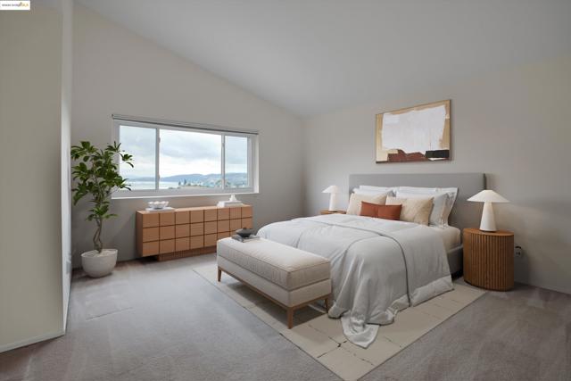 Carpeted bedroom featuring vaulted ceiling