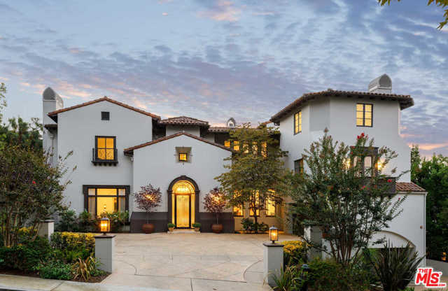 3307 Clerendon Road Beverly Hills, California Situated in the prestigious, 24-hour, guard-gated Beverly Hills enclave of Mulholland Estates, this Contemporary/Transitional residence has been masterfully refreshed for the modern lifestyle. Offering absolute privacy & serenity, the approx 10,971-sq-ft estate captures far-reaching canyon & city views while providing unmatched amenities for entertaining. A spectacular 2-story entry leads to the formal living and dining rooms, family room with bar & stunning chefs kitchen with dual marble islands. Interiors segue to the resort-style backyard with an outdoor living room, fireplace, pool, spa & expansive grass lawn. Entertaining continues on the lower level, which features a nightclub, 13-person+ theater & a recording studio, which may serve as a guest suite. 7 bedrooms include the 2nd-floor primary suite with fireplace, spa bath, dressing room & balcony. Features include an office, library, 2 staircases, staff quarters, dual 2-car garages, spacious motor court & RTI home system.