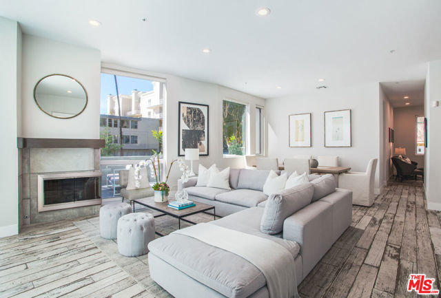 401 California Avenue 1 Santa Monica, California Exquisitely executed design and the finest materials create an elevated lifestyle - the 12-foot ceilings and walls of glass and the massive wrap-around private patio impart light, volume, and space. Walker-Zanger porcelain farmhouse tile floors, an artful kitchen with cerused oak cabinets, quartz counters and high-end stainless steel appliances. A large den perfect for home office, gym or guests plus a 3/4 bath round out the first level. Upstairs, three spacious bedrooms including an impressive corner primary suite with city views and a luxurious bath with glassed shower stall and separate soaking tub. Over 2,000 SF. 2-car side-by-side parking in security garage, elevator building, additional secured storage, guest parking and Earthquake insurance. Exclusive Santa Monica location North of Wilshire and just steps to Ocean Ave, Santa Monica beach, Third Street Promenade, Palisades Park, Montana Ave and more. Absolutely beautiful!