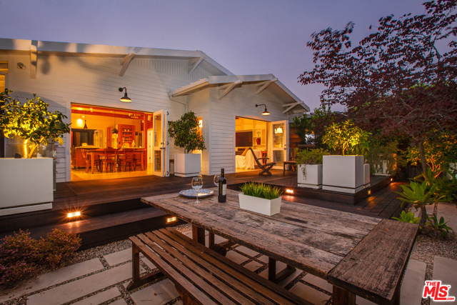 924 Amoroso Place Venice, California Located on one of Venice's most exclusive walk streets, this astonishing architectural craftsman features multiple indoor/outdoor spaces, exceptional light, 4 car parking -- and a rooftop guestroom with private deck. Numerous eco/ comfort features include a full home Lutron lighting system, radiant floor heating, HD/3D surround sound A/V system, full house SONOS audio system , full house water purification system, solar heating, Fleetwood accordion doors and for barbecue enthusiasts, an outdoor DCS barbecue. An incredible list of modern features continues with; 2 Jotul kitchen gas stoves, 960 sq.ft of outdoor decking. drought tolerant garden. and out door shower. Even the garage distinguishes itself with in-place 220 volt EV fast charger, red stainless steel cabinets by VAULT, and state of the art space saving racks for boards & bikes. NOTE: Plans for a vertical exlansion of this home are available for inspection.