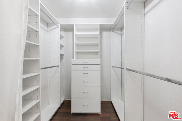 Walk-In Closet Inside Primary Bedroom