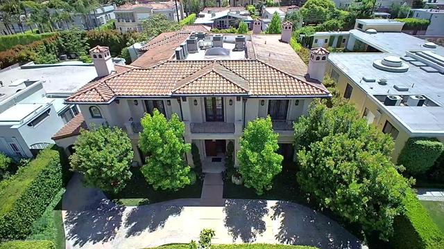 617 N Camden Drive Beverly Hills, California A magnificent gated private Mediterranean single-family home, located in one of the most desirable and exclusive areas of Beverly Hills. Elegant design with extra attention to quality, rich detail w/ captivating formal entryway w/custom mosaic centerpiece, beautiful curved stairwell, and equipped w/ SmartHome Crestron. On the main level is a craftsmanship wooden library, powder room & remarkable kitchen w/ LED lighted island. Upstairs level features a sitting lounge, 3 bedroom suites & an elegant master suite w/ fireplace, walk-in closet, & exquisite bath w/ LED lighted onyx walkway & shower backsplash. The lower level includes a sophisticated movie theater, wine cellar, game room, family room, full bar, sauna, steam shower, guest quarters/gym & maid's quarter & laundry room. The backyard w/ modern fiber optic lit waterfalls, pool & spa.