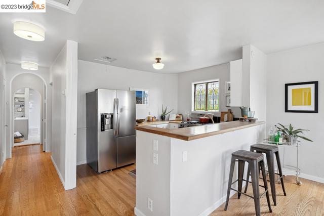 Open kitchen with a breakfast bar.