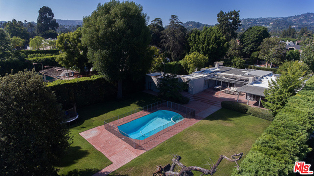 713 N Crescent Drive Beverly Hills, California Large sprawling lot located on the coveted 700 block of Crescent in the heart of Beverly Hills, once the famed estate of Doris Day. This prime piece of real estate is perfect for any owner, user, or developer. 4,309 sq ft home is currently leased for $17,000 a month through June. Property is in plan check and scheduled for approval in June 2021 to build a 12,000 sqft house with a 1,000 sqft guest house designed by the esteemed luxury architect Ken Ungar. A lot and a half comprising a width of 120 feet and approximately 30,000 feet total. This is a rare opportunity to build a brand new home in the most desirable location. Saving up to a year of time, by close of escrow buyer will obtain plans and permits RTI.