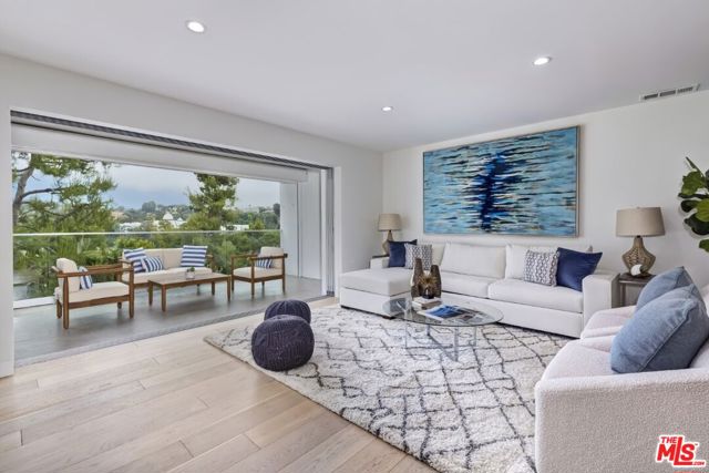 17339 Tramonto Drive 101 Pacific Palisades, California The definition of California living! From the moment you enter this light and airy single-level unit, you will be captivated. Featuring wide-plank light oak wood floors, custom built-ins and tremendous natural light in 1,843 square feet of interior living space. The absolutely stunning expansive living / dining / kitchen area contains pocket Fleetwood doors that slide completely open to connect the interior and large covered patio all enjoying beautiful and serene outlooks. The well-appointed kitchen boasts a large center-island, Thermador appliances, Carrera marble countertops, custom wood cabinetry, and an abundance of storage. A central hallway leads to the 3 spacious bedrooms and two full baths that have been tastefully updated with Hansgrohe faucets and Limestone. Additional features include two custom Elfa-designed walk-in closets, an extra large exterior storage unit, and potential for in-unit laundry. Enjoy complex amenities such as swimming pool, sauna, fitness center and multi-purpose recreation room. Ideally located just minutes from PCH, Santa Monica, Malibu and the heart of the Palisades Village. Hiking trails, the beach, restaurants, Chabad, PJECC, Waldorf School, Lake Shrine and a grocery store all within a two block radius! Unit was completely remodeled in 2015 with no expense spared. Building lobbies are in process of being updated with no assessment. One parking space issued with a option for second space that may be rented for approx $60/mo.