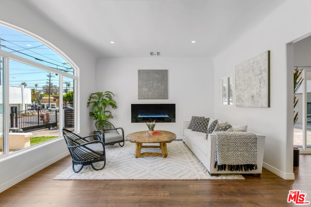 1011 Superba Avenue Venice, California NEW PRICE! Fall in love with this one-of-a-kind beautifully remodeled Spanish home in the heart of Venice! Enter through the iron gates of this private oasis to a gorgeous 3 bedroom 2 bath home that perfectly blends authentic 1920s charm with modern luxury. Upon entering through the stunning authentic wooden door into the living room, you will be astounded by the open concept floor plan, high ceilings, fireplace, and large windows and sliding doors flooding the home with light. Cook to your hearts content in the impeccable chefs kitchen with center island/breakfast bar, stainless steel appliances, quartz countertops and unique tile backsplash. The kitchen opens to the dining area and the backyard, making it a perfect home for entertaining. The well appointed master bedroom has a beautiful arched window, flooding the room with light, and ample closet space. The master bath features intricate tiles and a rain shower. There are two additional decadent bedrooms, perfect for guest suites or a home office. The finished detached garage has a glass door and windowed garage door, and could be used as an at home gym or art studio, or converted to an ADU. The home is complete with a Nest thermostat and Ring doorbell. Welcome home to your luxurious retreat in the heart of Venice! Dont miss out on this amazing opportunity!