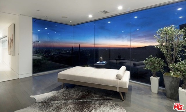 1654 BLUE JAY Way Los Angeles, California Majestically perched at the very top of the most iconic Bird Street of them all, Blue Jay Way,this newly renovated modern masterpiece flaunts endless views from the Downtown skyline to the Pacific. Every room is bathed in light through shimmering floor to ceiling walls of glass, and an unparalleled wraparound deck takes outdoor entertaining to a stratospheric new level. A private bar, home cinema, wine cellar, massive living spaces, a private club this one has it all. Be the lord of your own kingdom, looking down on all the neighboring stars from your palatial throne. Here's your chance to own a crown jewel of the most prestigious section of the legendary Hollywood Hills. Best PPSQ in the Bird Streets.