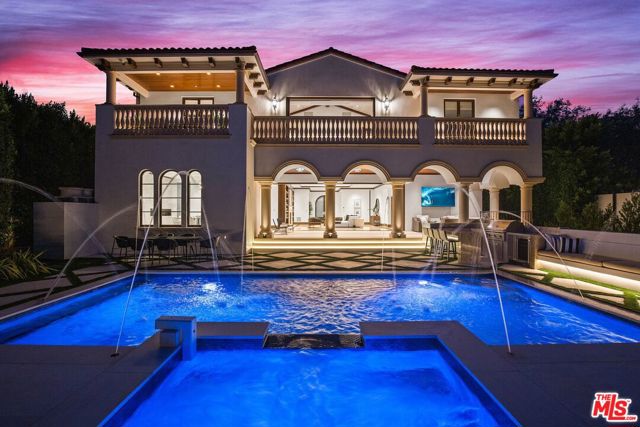 508 N Alpine Drive Beverly Hills, California Offering absolute privacy in the prestigious Beverly Hills Flats, this extraordinary, new European-inspired residence showcases masterful craftsmanship, blending old world traditions and contemporary design. Every meticulous detail has been carefully curated, hand-placed and sourced from around the world, displaying the passion and vision of Roman James Design Build. Pass through the gates to the Italian stone motor court, where custom stone arches hold court over the French Beiber front door. Exceptional detail within includes Antolini stone floors and German-sourced, hand-stained wood cabinetry. The first floor boasts an office, guest suite, formal living room, dining room with wine storage and chefs kitchen with Miele appliances. 7 bedrooms include the 2nd-floor primary suite with partners dressing rooms, Antolini spa bath and terrace. Amenities include a 12-seat professional theater, fitness studio, pool, spa, outdoor kitchen/bar, cascading water wall, and 5-car auto gallery.